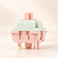 TAVNIXO Wind Chime linear mechanical keyboard switch in pastel mint green and blush pink