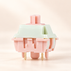TAVNIXO Wind Chime linear mechanical keyboard switch in pastel mint green and blush pink